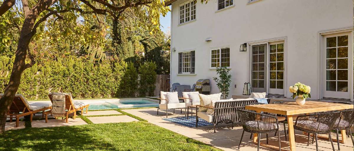 A beautifully landscaped yard with well-trimmed trees